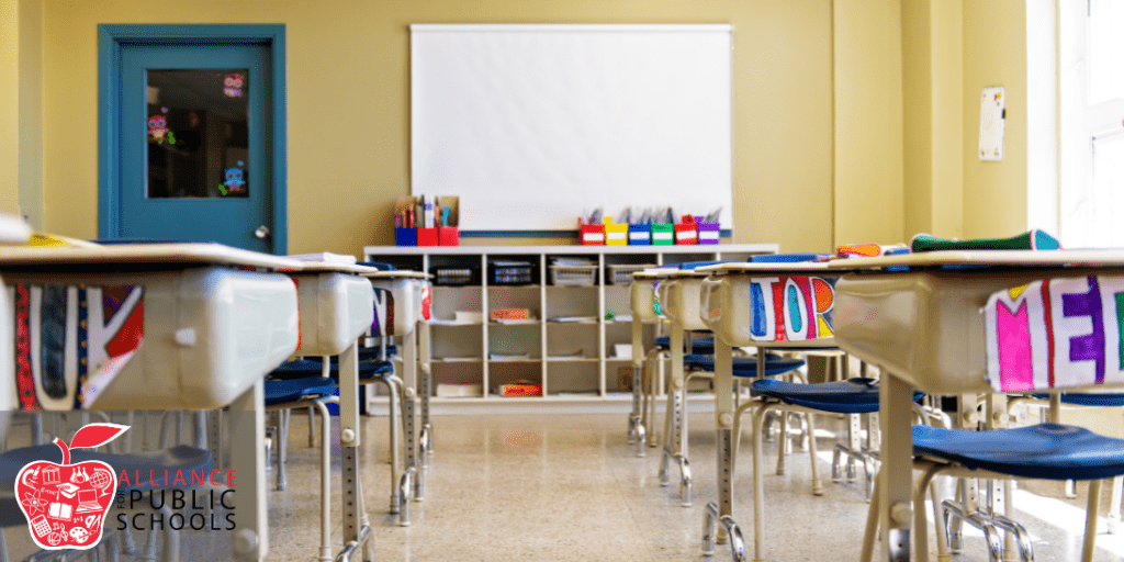 photo of empty classroom with desks