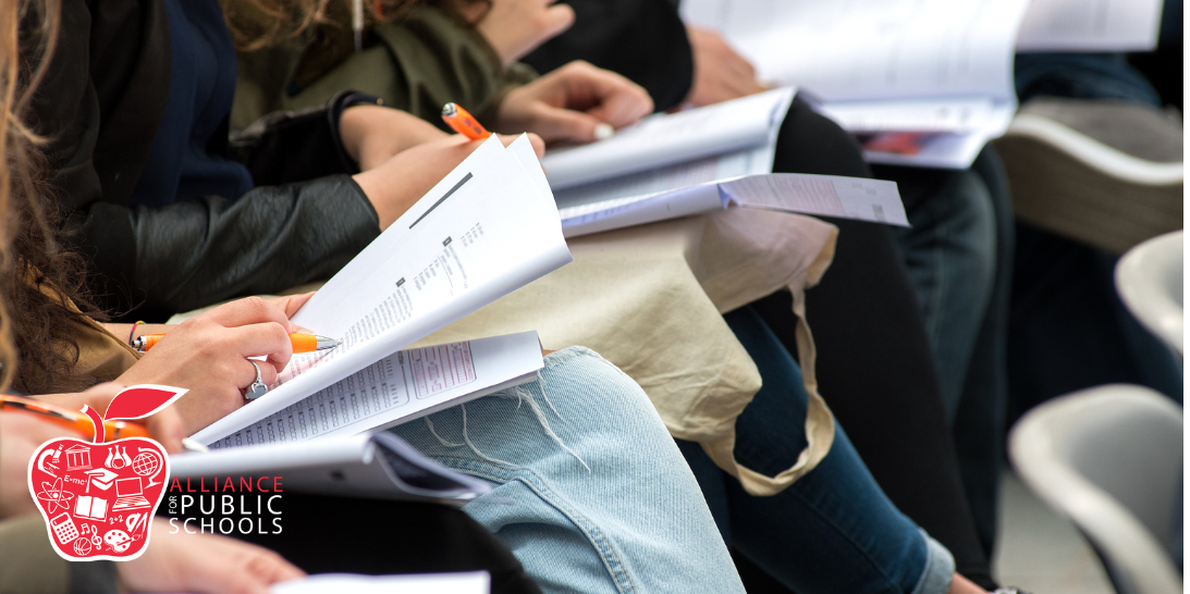 blog post photo of students working on papers