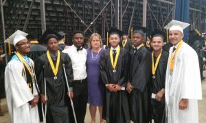 photo of Melissa Erickson with graduating students from Blake High School