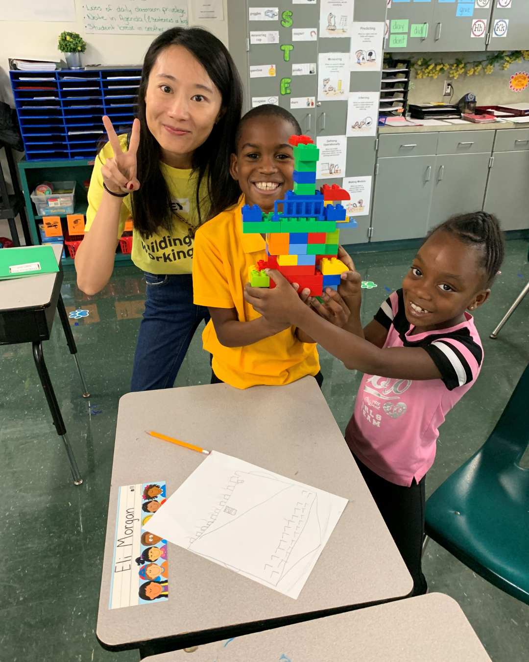 teacher doing a stem activity with students